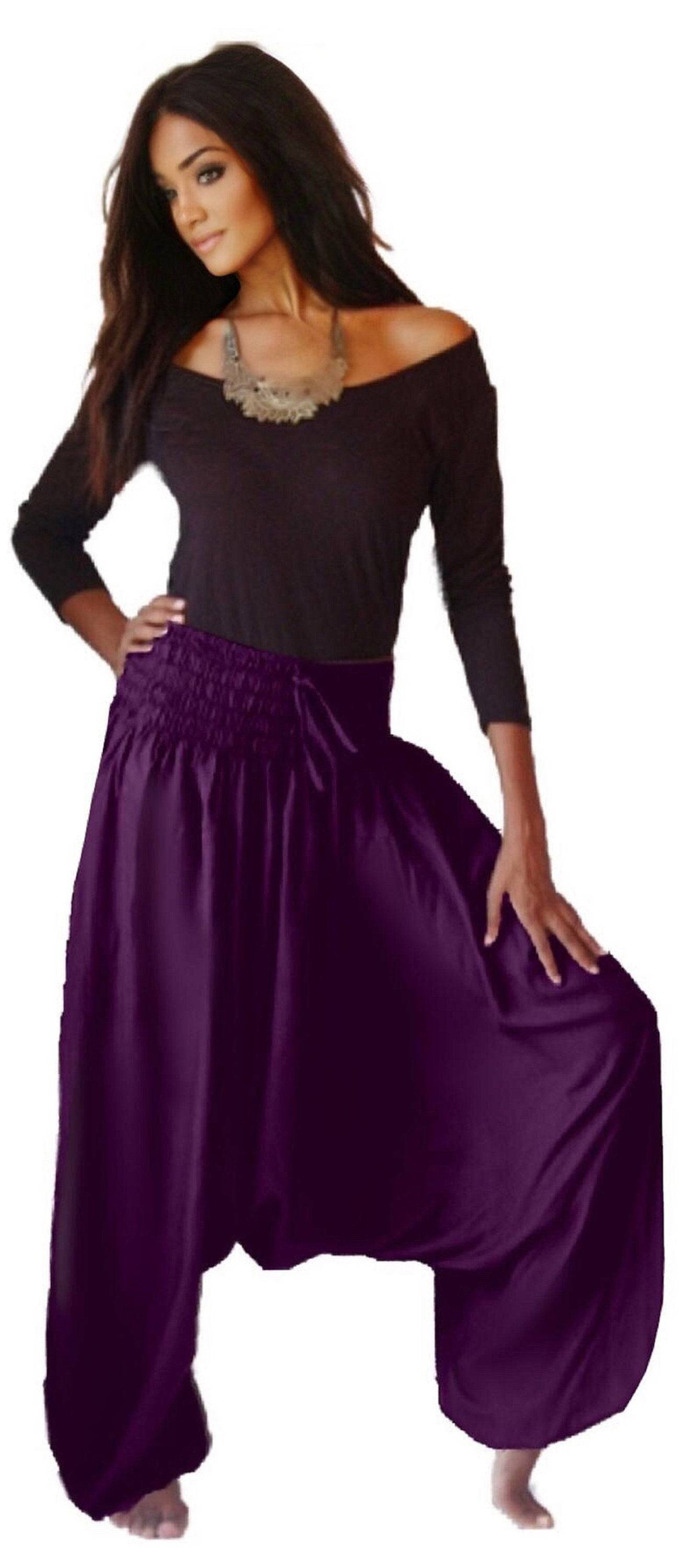 Purple harem diaper pants for women with an elastic smocked waistband, offering a loose and comfortable fit for casual or yoga wear.