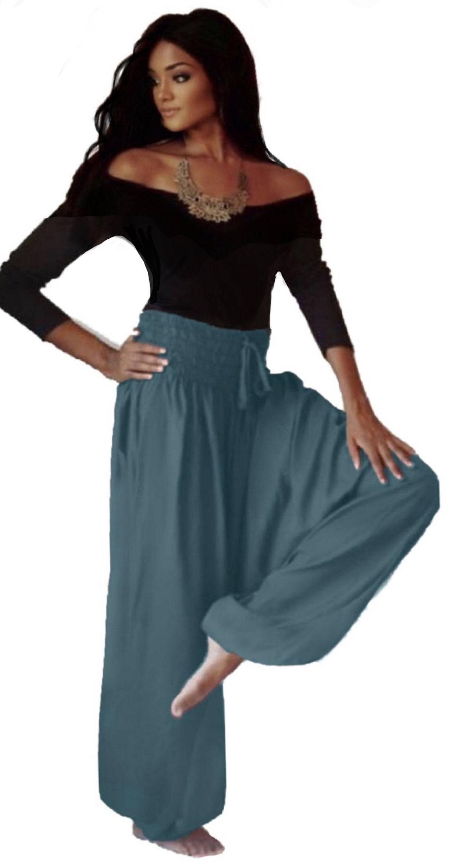 Teal harem diaper pants with an elastic smocked waist, offering a comfortable and stylish fit for women in a loose, flowy design.