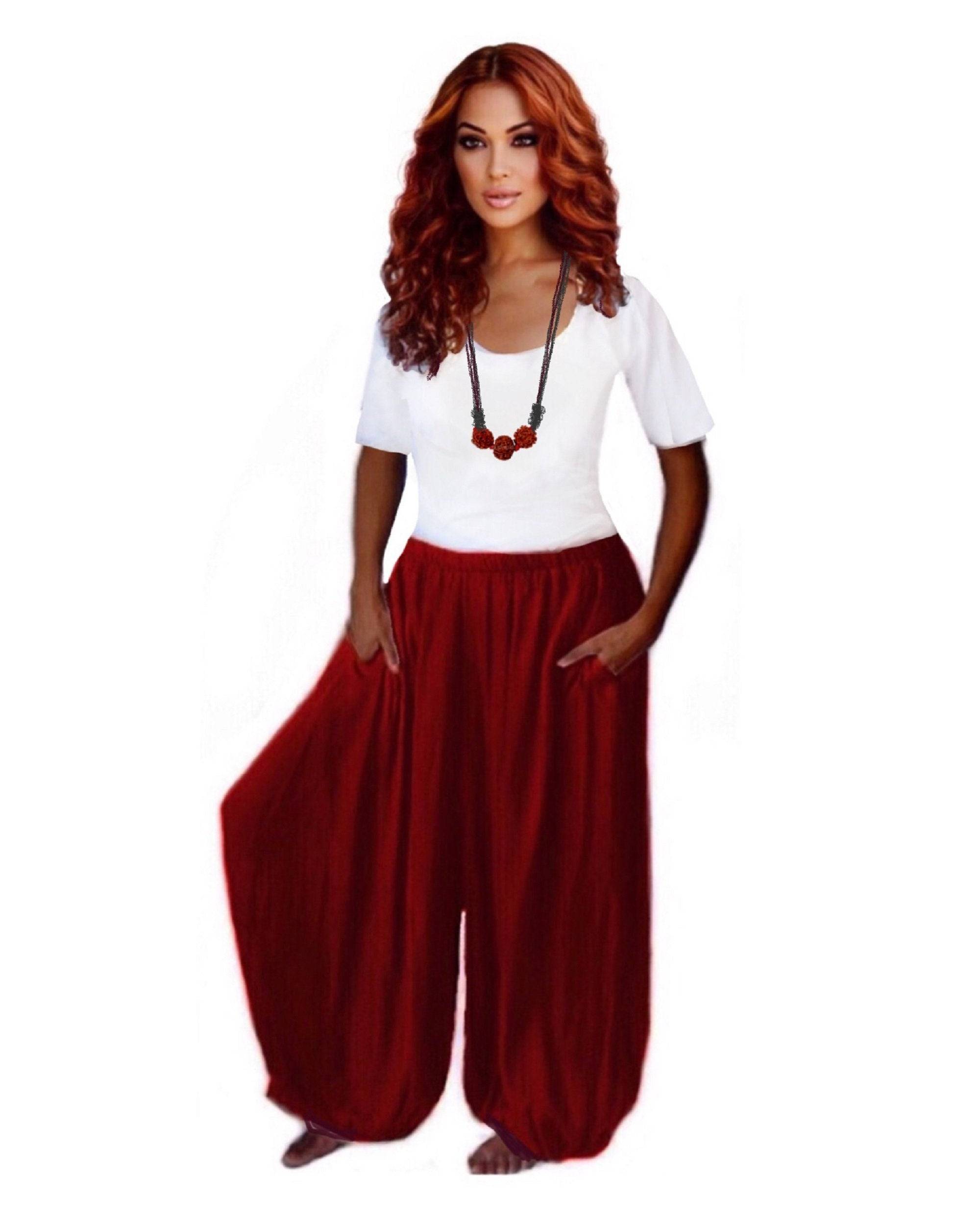 Rust red overall harem hippy pants with wide leg gaucho, plus size. Relaxed-fit bohemian pants with an elastic waistband and side pockets.