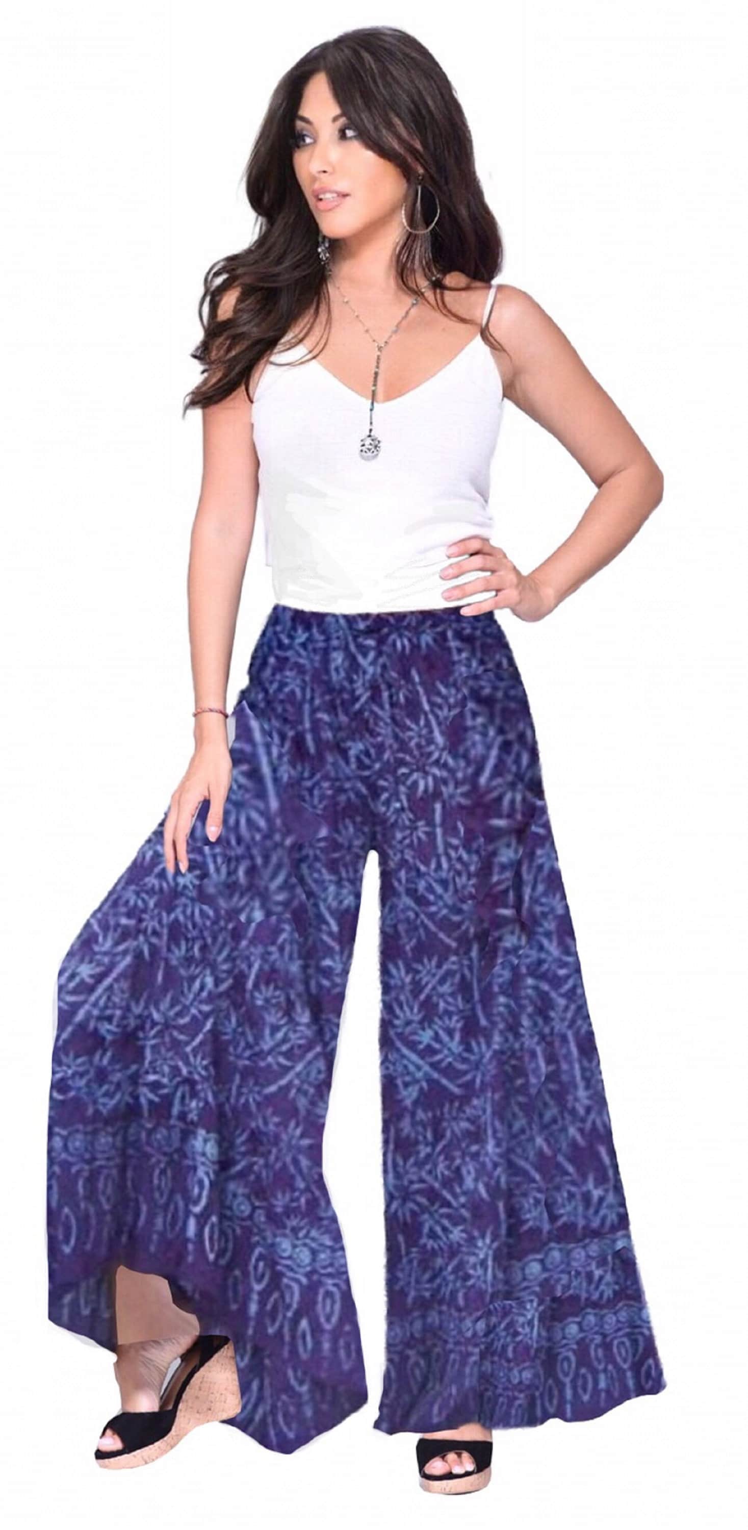 Purple batik print wide leg hippie pants with elastic waist and drawstring. Flowy and stylish bohemian fashion for women.