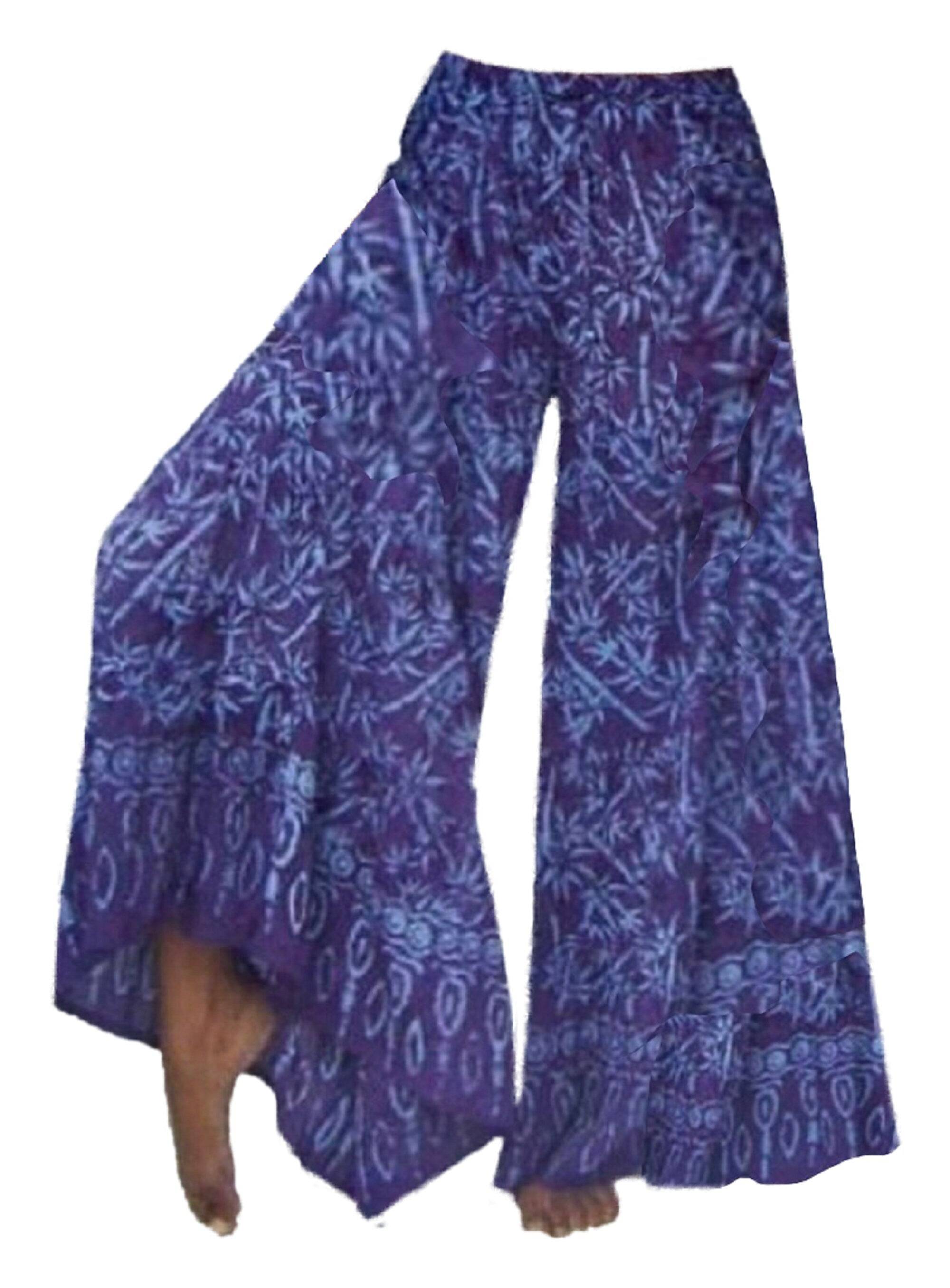 Purple Bali batik print wide leg hippie pants with intricate designs. Comfortable and breathable fabric with an elastic waist and drawstring.