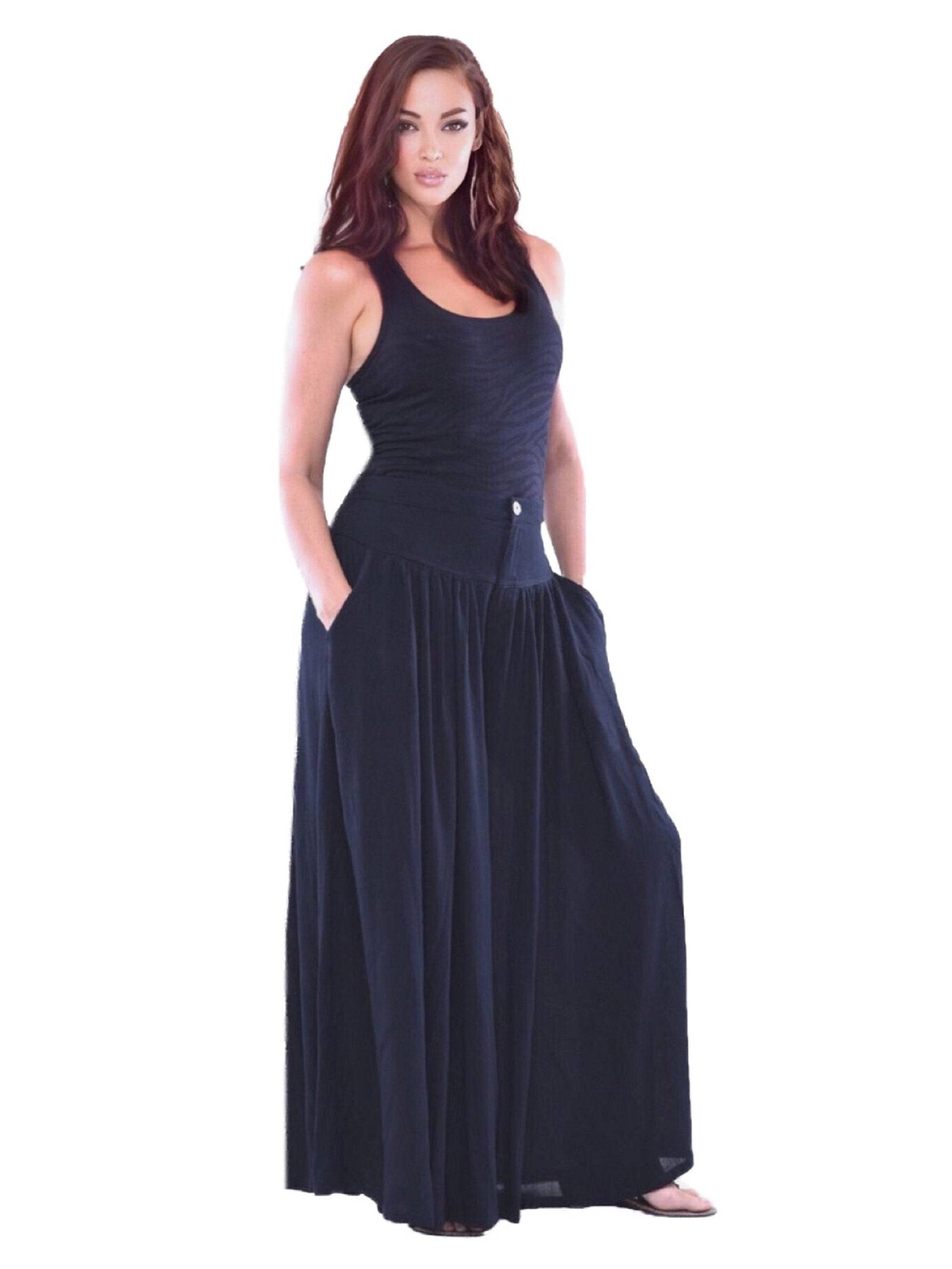 Black split skirt palazzo pants with pockets, elastic back, and wide-leg silhouette. A classic and elegant wardrobe staple.