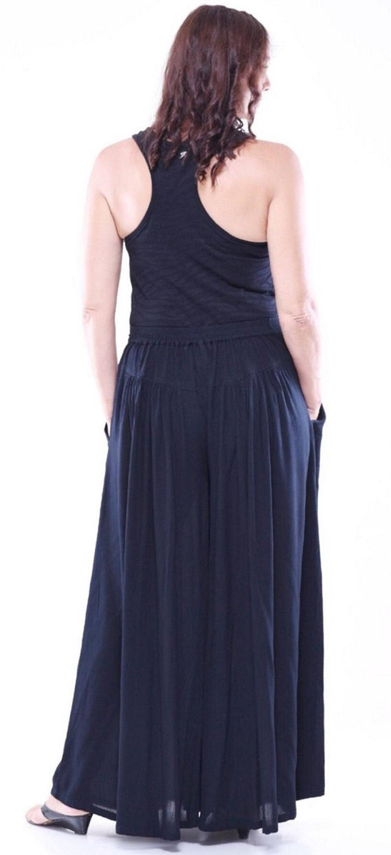 Back view of black split skirt palazzo pants with elastic waistband and wide-leg fit. Comfortable and stylish for any occasion.