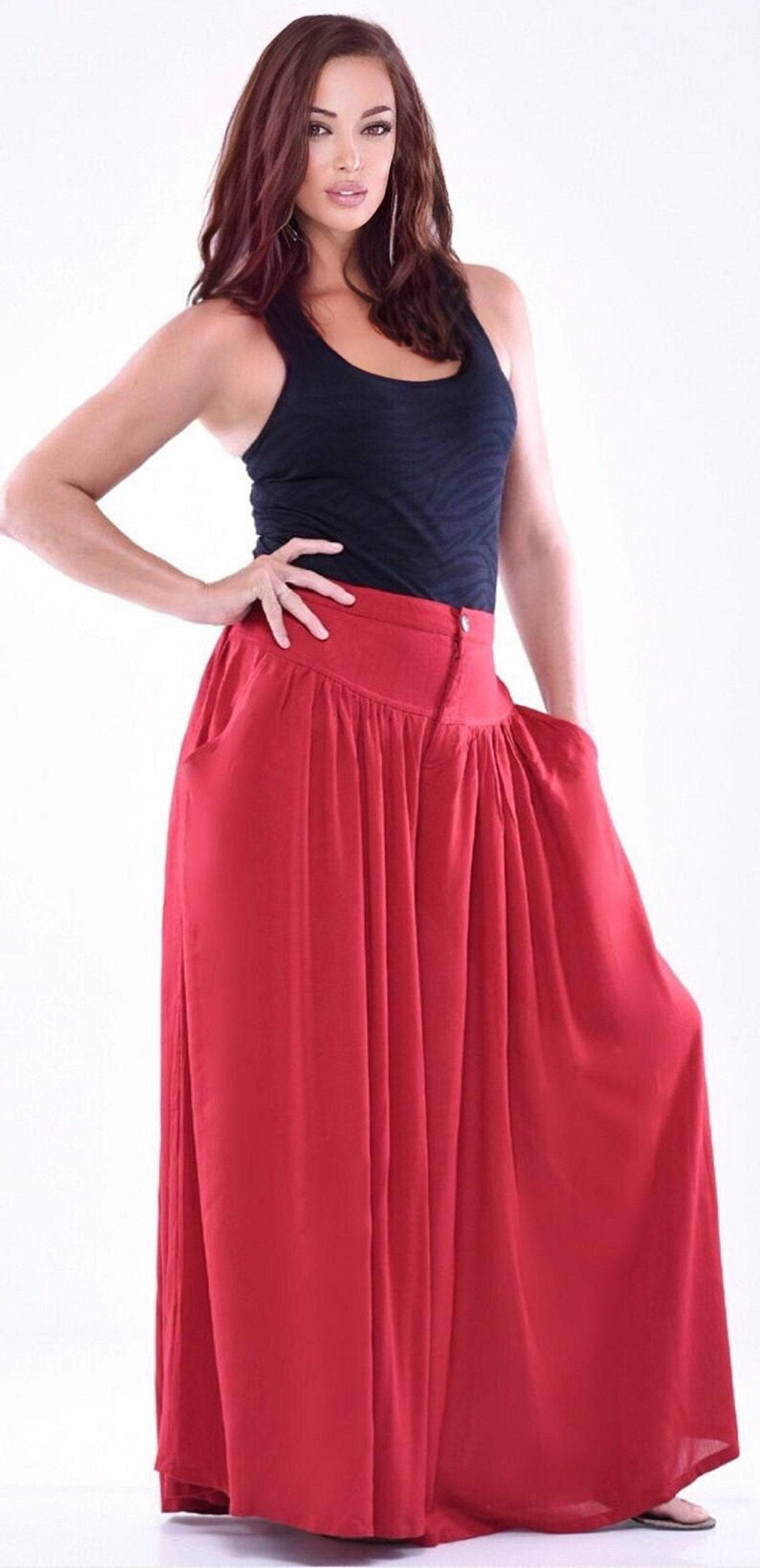 Red split skirt palazzo pants with pockets, elastic back, and wide-leg silhouette. Perfect for casual and elegant styling.