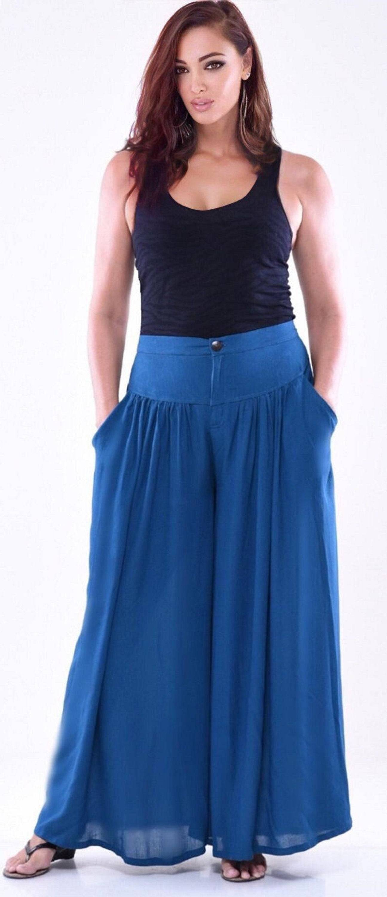 Blue split skirt palazzo pants with pockets, elastic back, and wide-leg design. A vibrant and fashionable choice for casual wear.