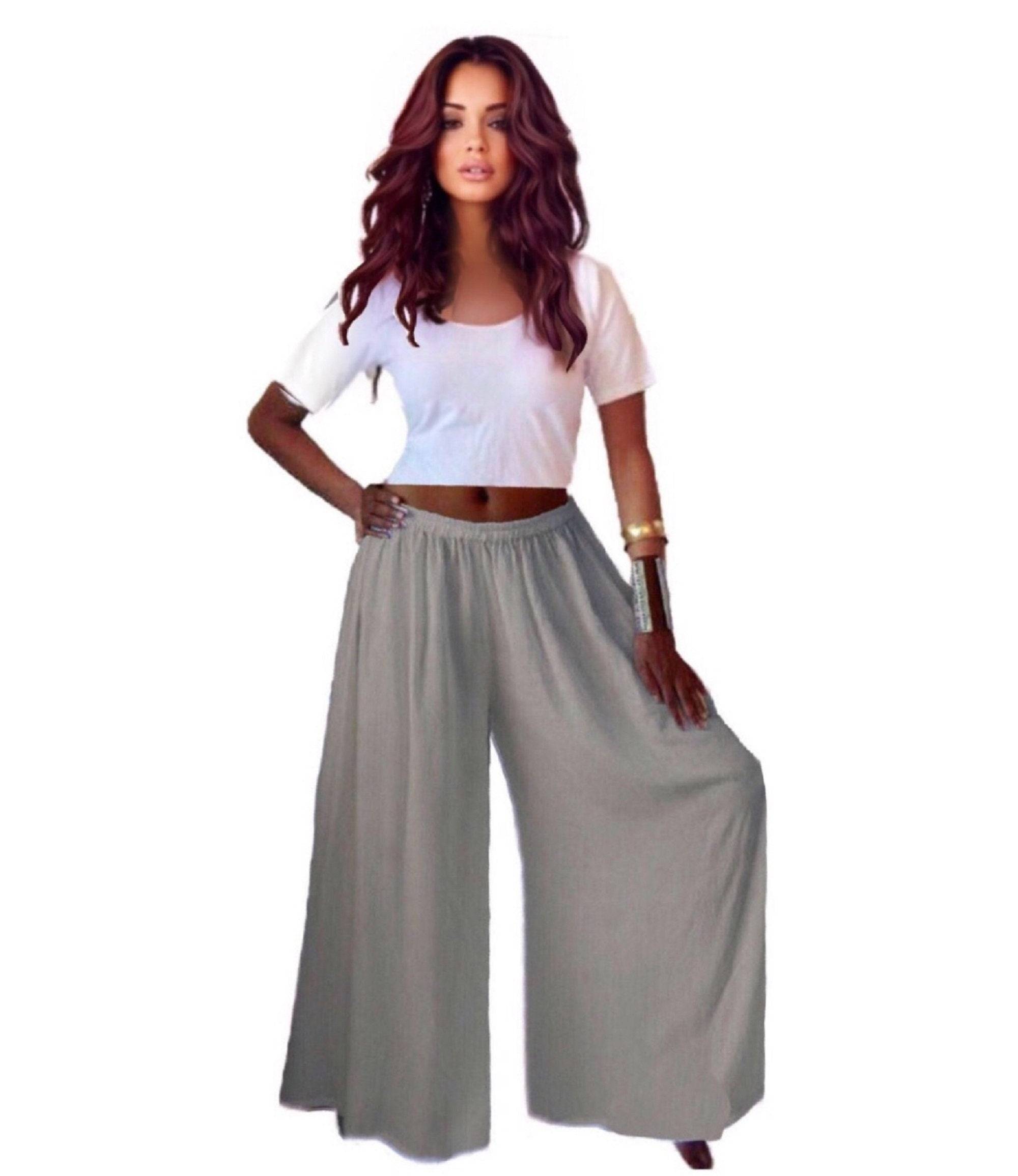Light gray split skirt gaucho palazzo pants with a wide-leg design and elastic waist, styled with a white crop top.