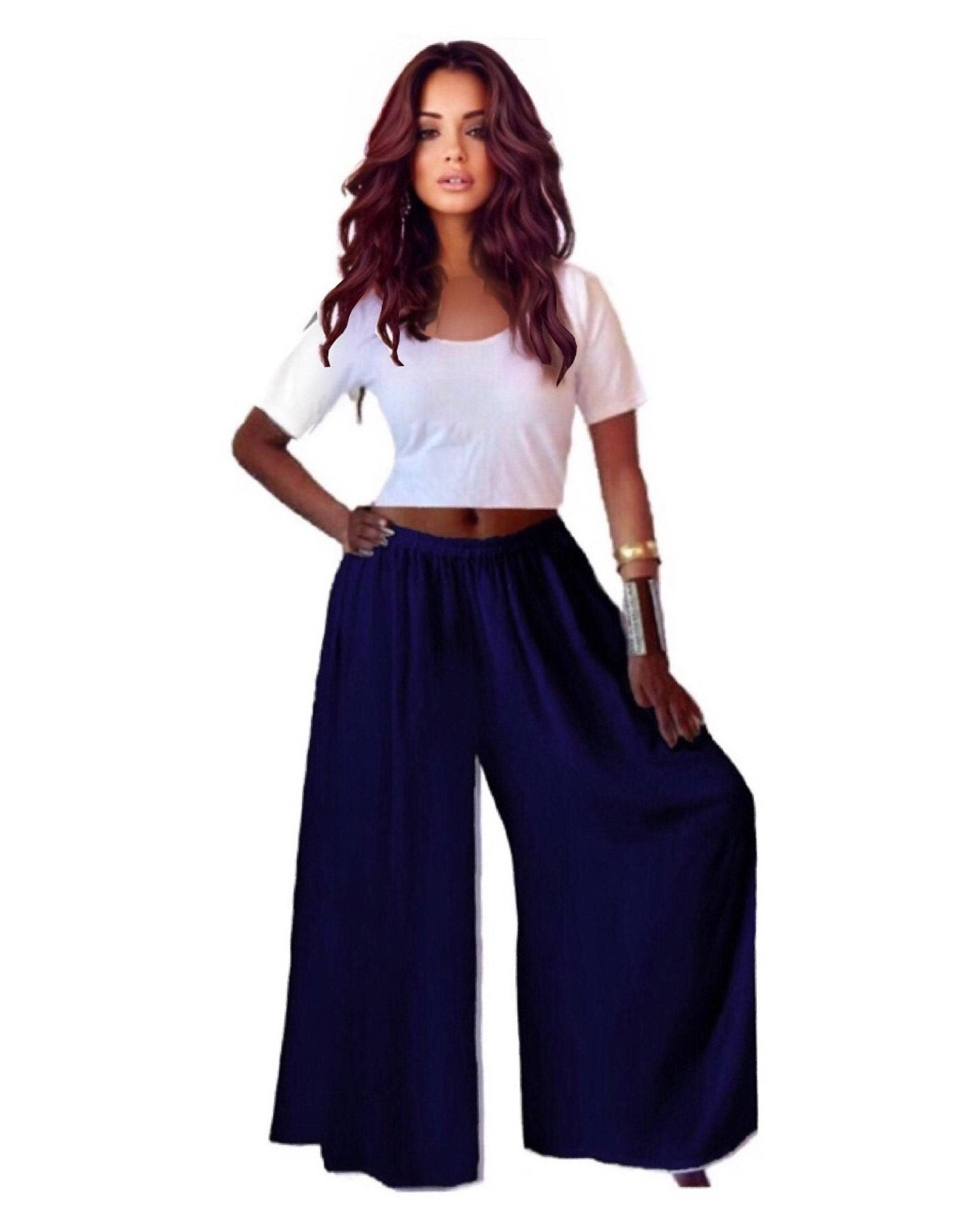 Navy blue split skirt gaucho palazzo pants with a wide-leg cut and elastic waistband, paired with a white crop top.