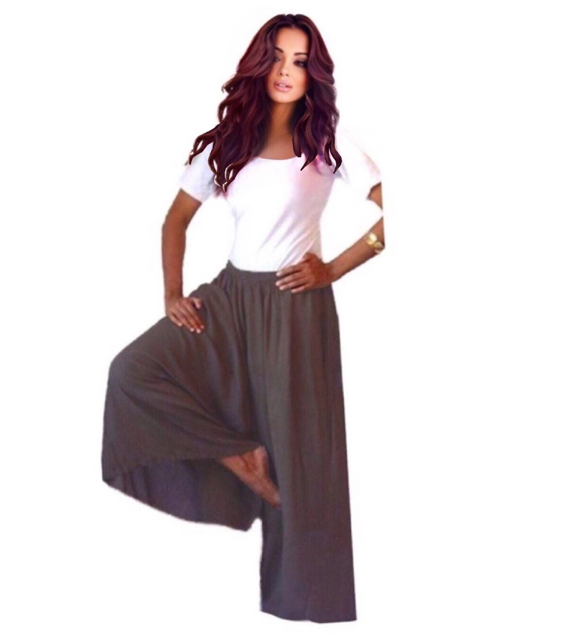 Dark brown split skirt gaucho palazzo pants with a wide leg and elastic waist, styled with a white crop top for a relaxed boho look.