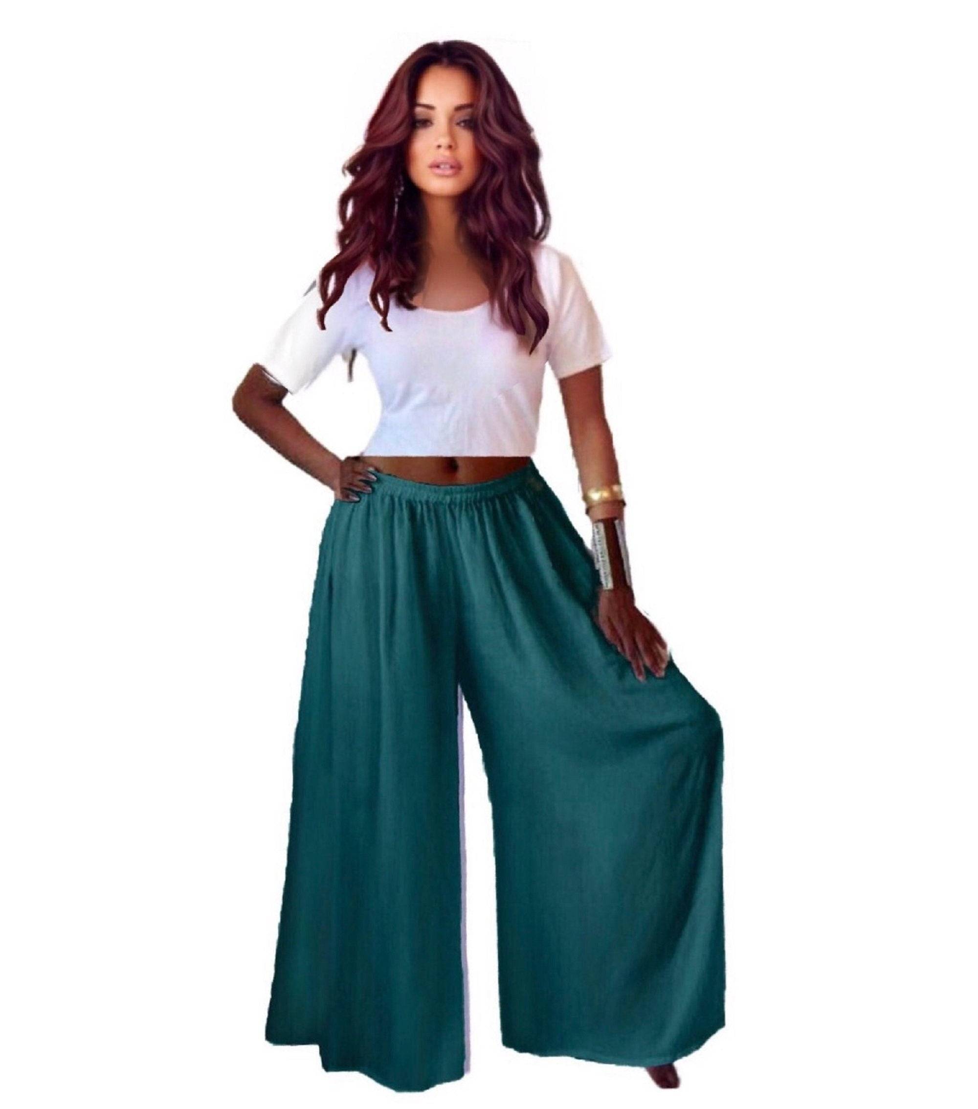 Teal split skirt gaucho palazzo pants with a wide-leg fit and elastic waist, styled with a white crop top.