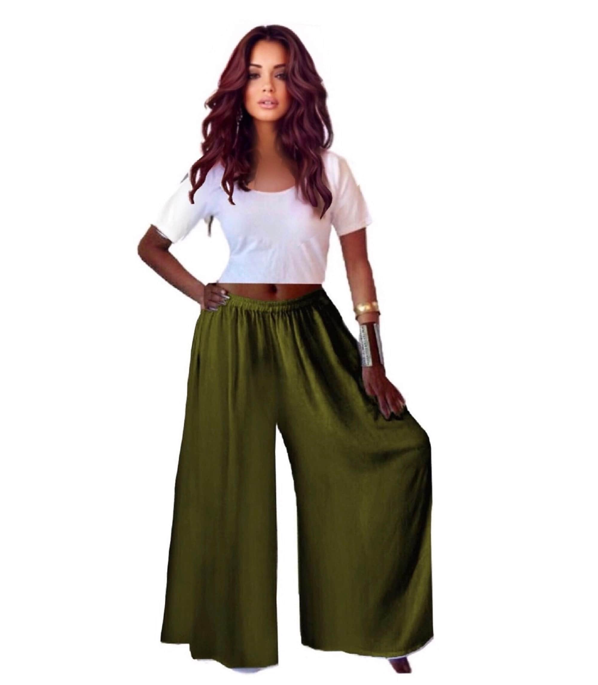 Olive green split skirt gaucho palazzo pants with a wide leg and elastic waist, paired with a white crop top for a stylish casual outfit.