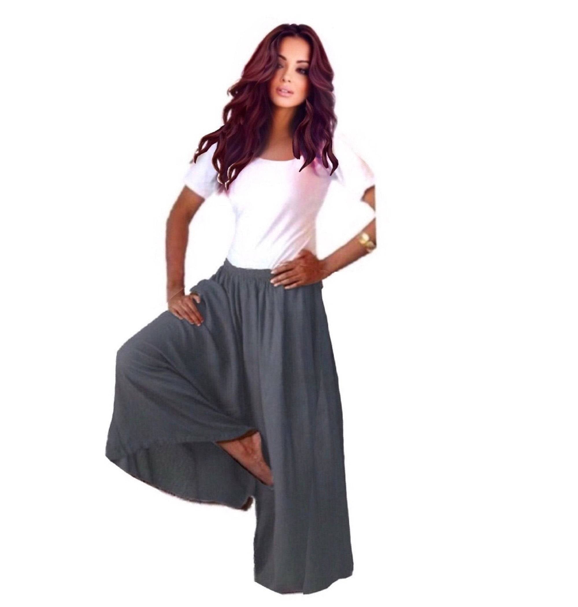 Dark gray split skirt gaucho palazzo pants with a wide-leg silhouette and elastic waist, styled with a white crop top.