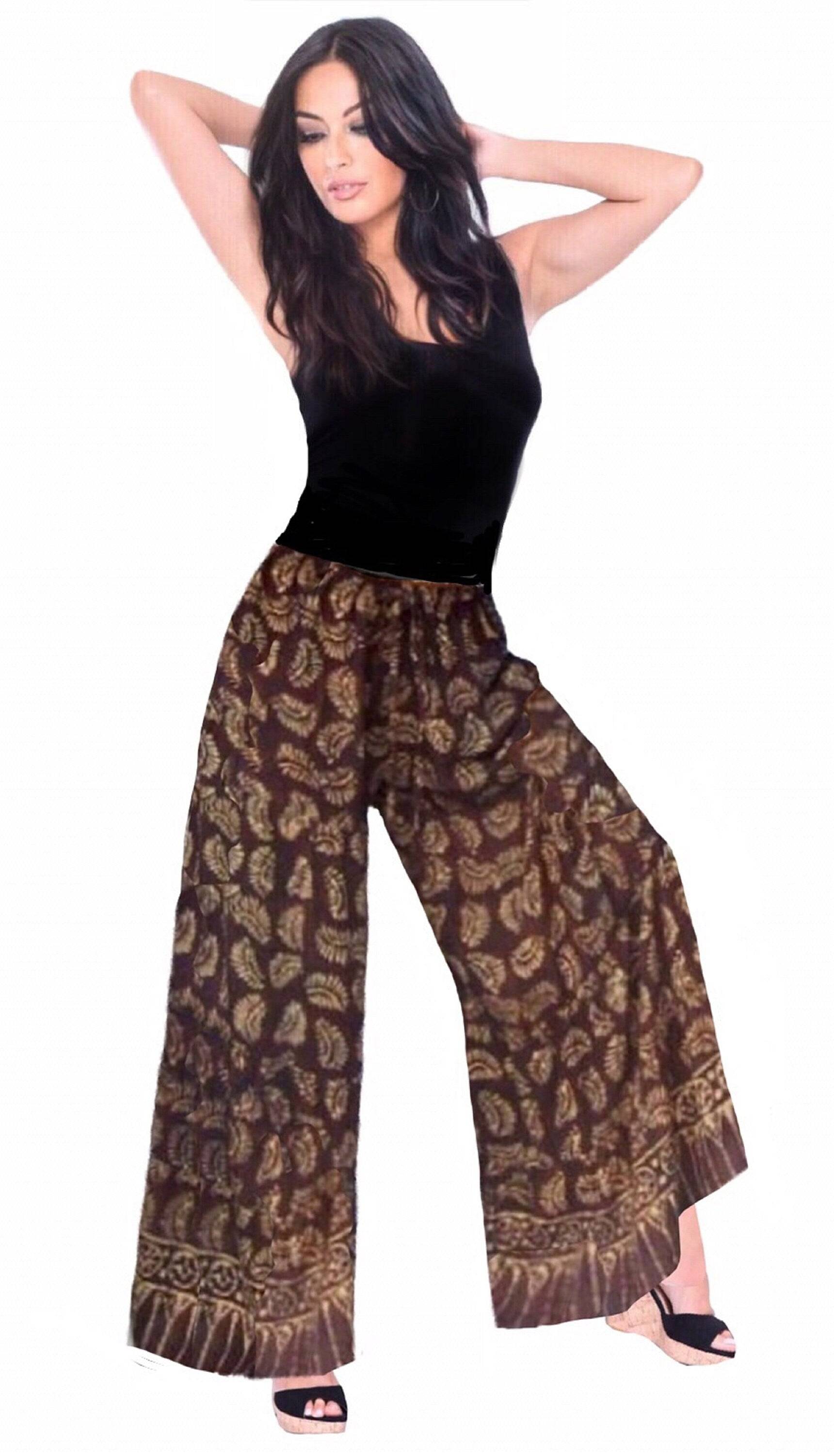 Brown batik print wide leg hippie pants with elastic waist and drawstring. Lightweight and comfortable boho-style women&
