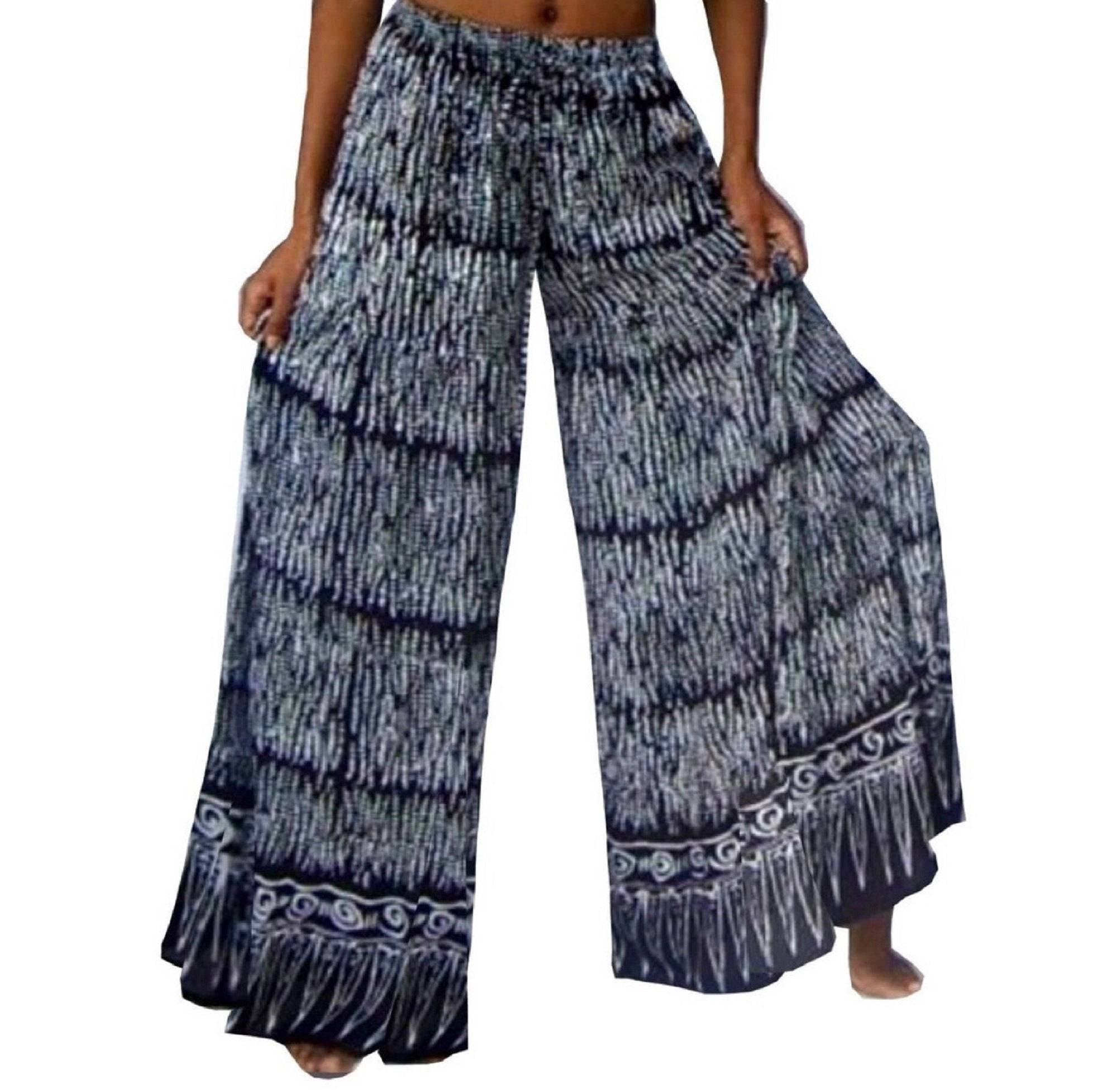 Black and white Bali batik print wide leg hippie pants with elastic waist and drawstring. Flowy and comfortable bohemian-style women&