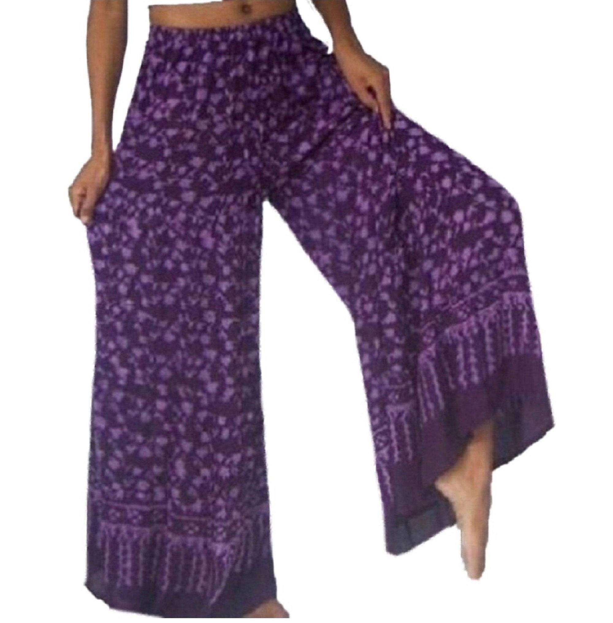 Purple floral batik print wide leg hippie pants with elastic waist and drawstring. Lightweight and stylish boho fashion for women.