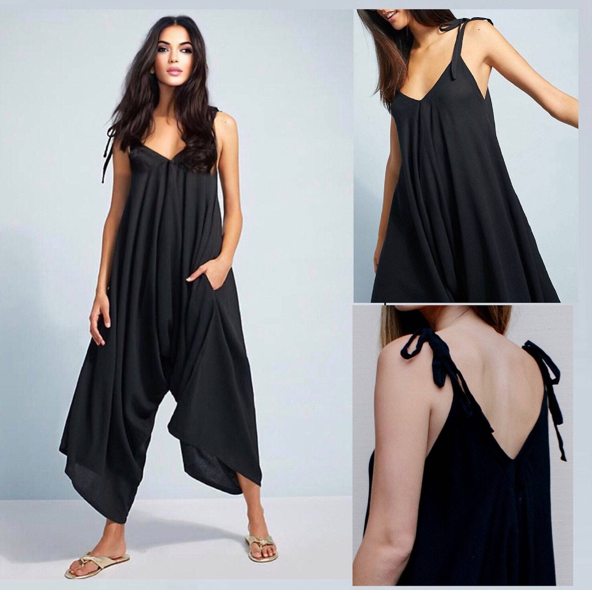 Black spaghetti angled straps jumpsuit with loose leg, featuring a relaxed fit and side pockets, perfect for casual wear.