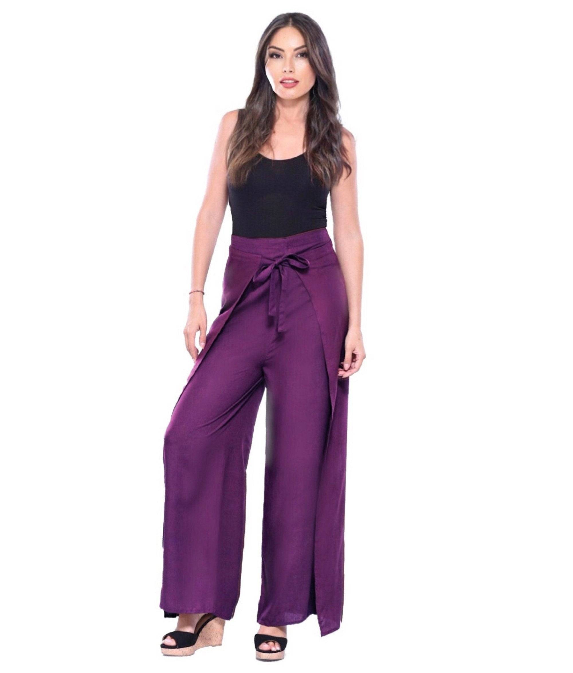 Purple wide-leg palazzo pants with wrap tie, styled with a black top. Flowy and fashionable design for all sizes.