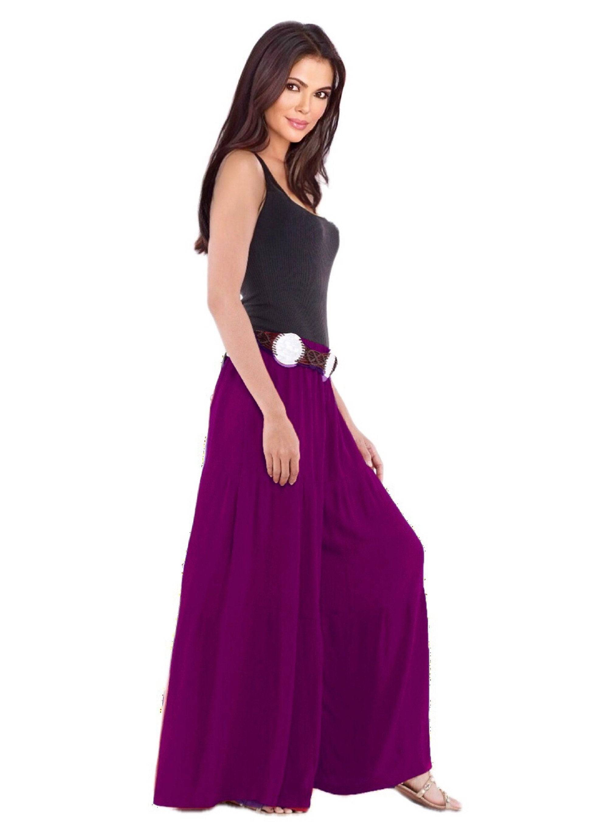 Purple gauchos wide-leg ruffled pants with an elastic waist and drawstring ties. A vibrant and fashionable choice for any occasion.