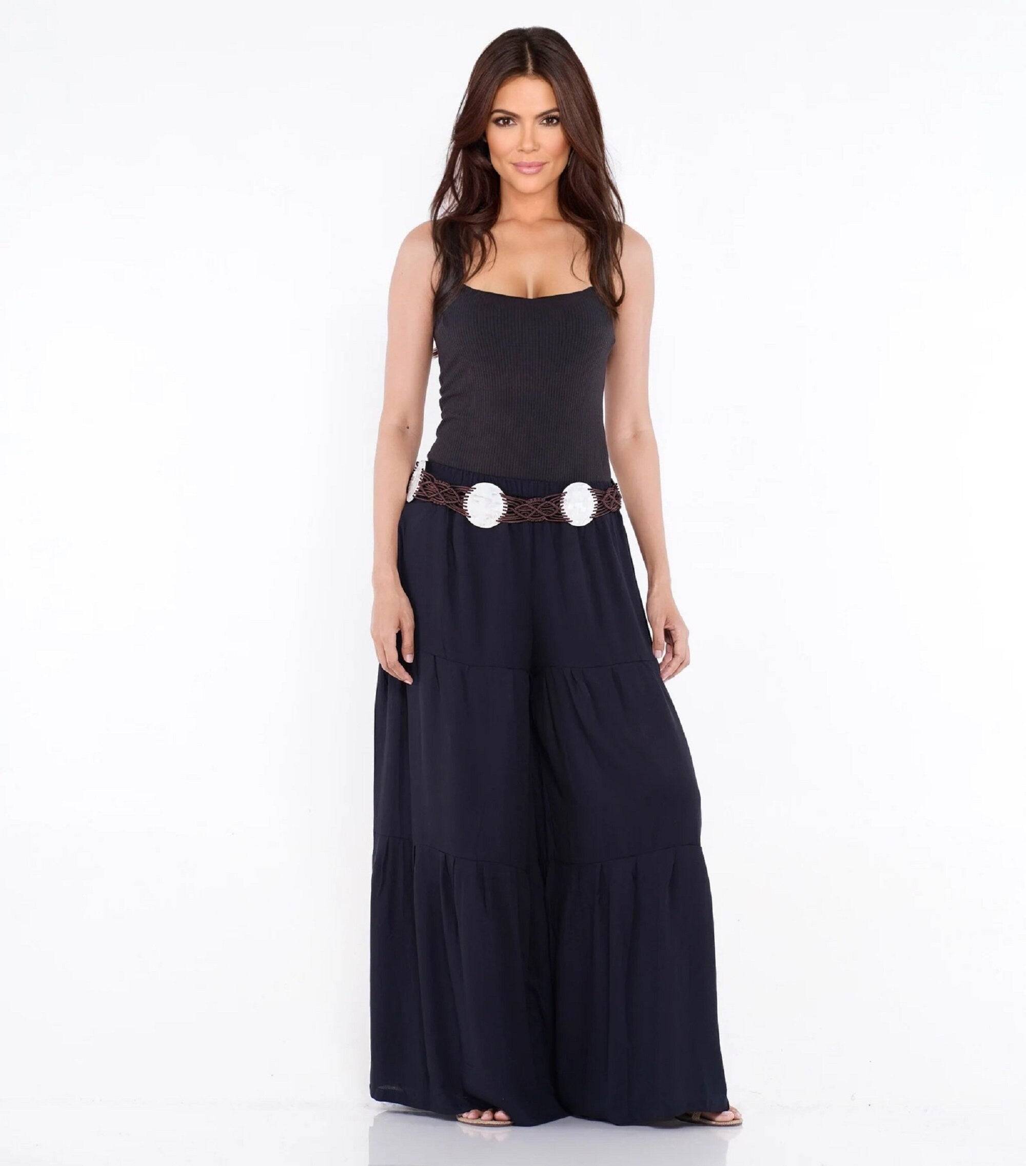 Black gauchos wide-leg ruffled pants with an elastic waist and drawstring ties. Flowy and elegant design for all sizes.