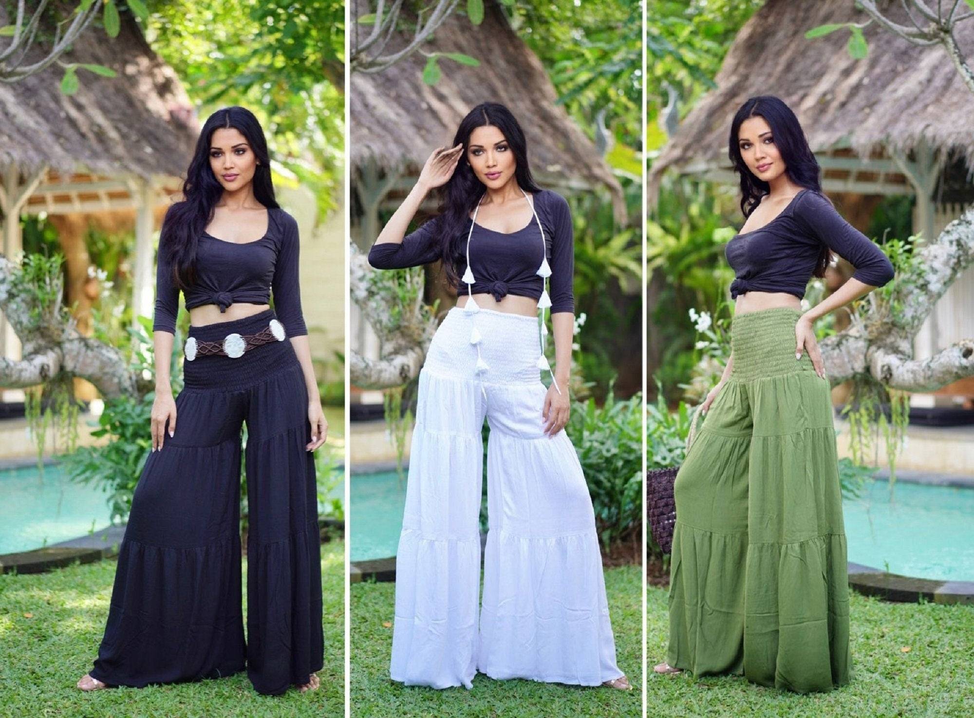 Smocked waist ruffled palazzo pants with wide leg in black, white, and green, available in sizes S-5X. Stylish and comfortable women&