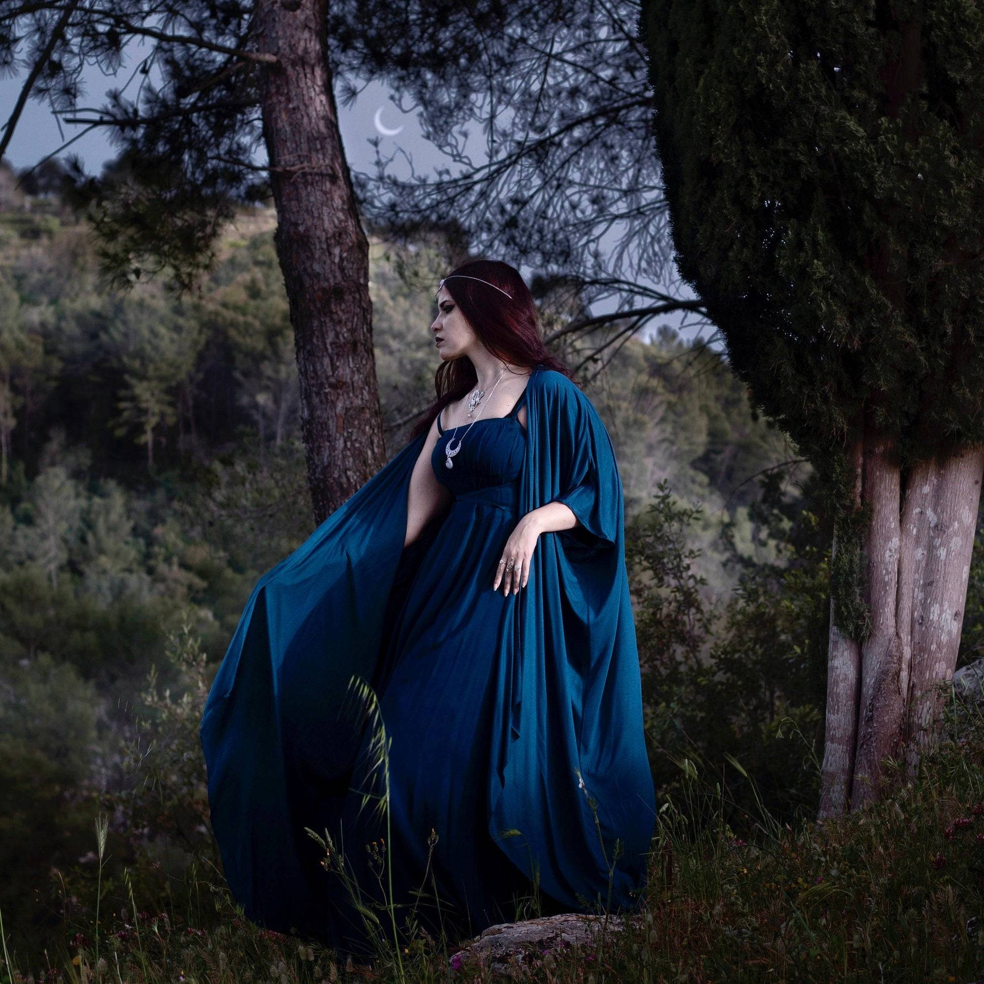 Enchanting blue maxi dress with a cape overlay, perfect for gothic and fantasy-inspired fashion, available in all sizes.