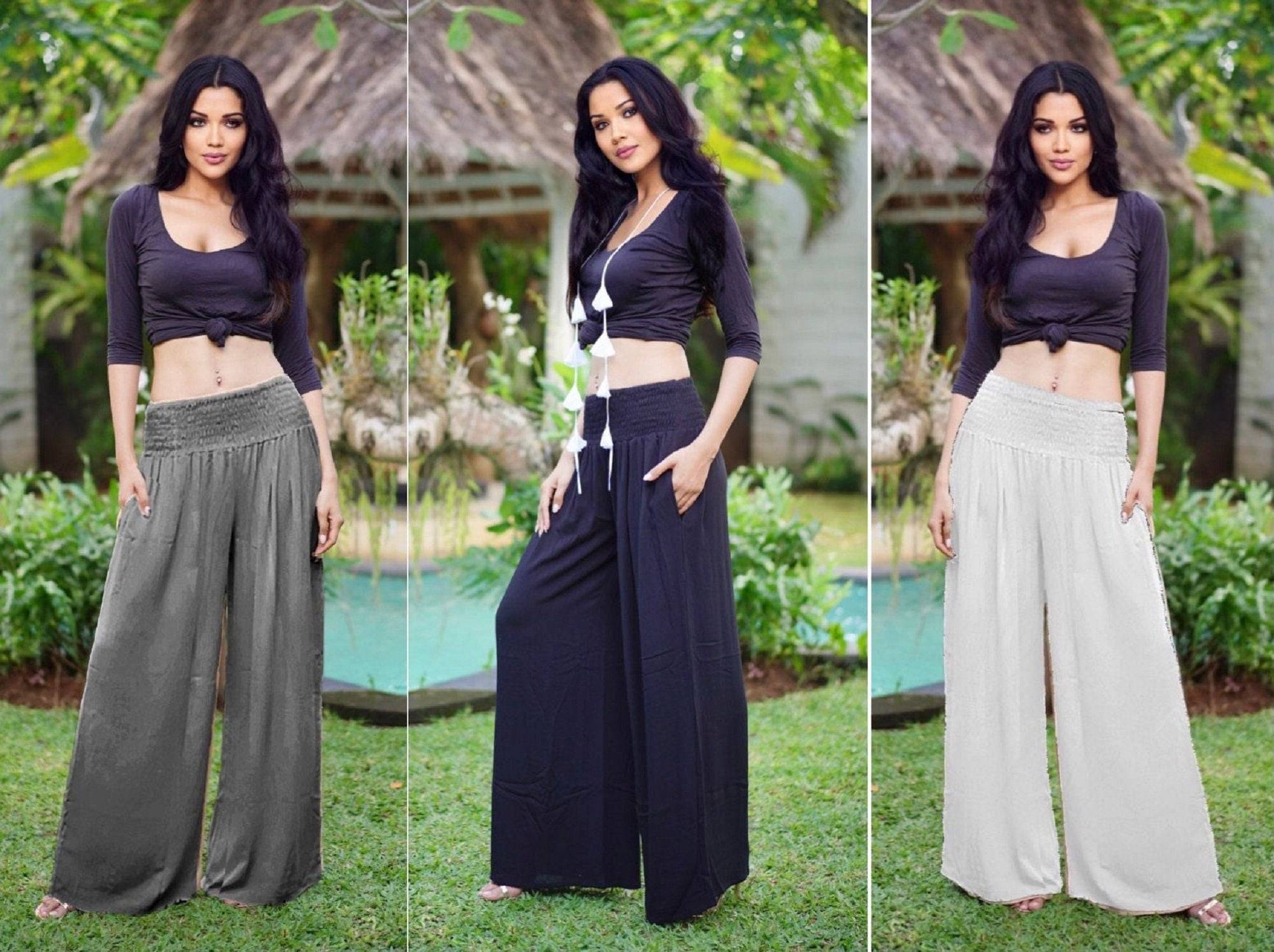 Wide leg palazzo pants with smocked waist in multiple colors, available in sizes S-5X. Comfortable and stylish women&