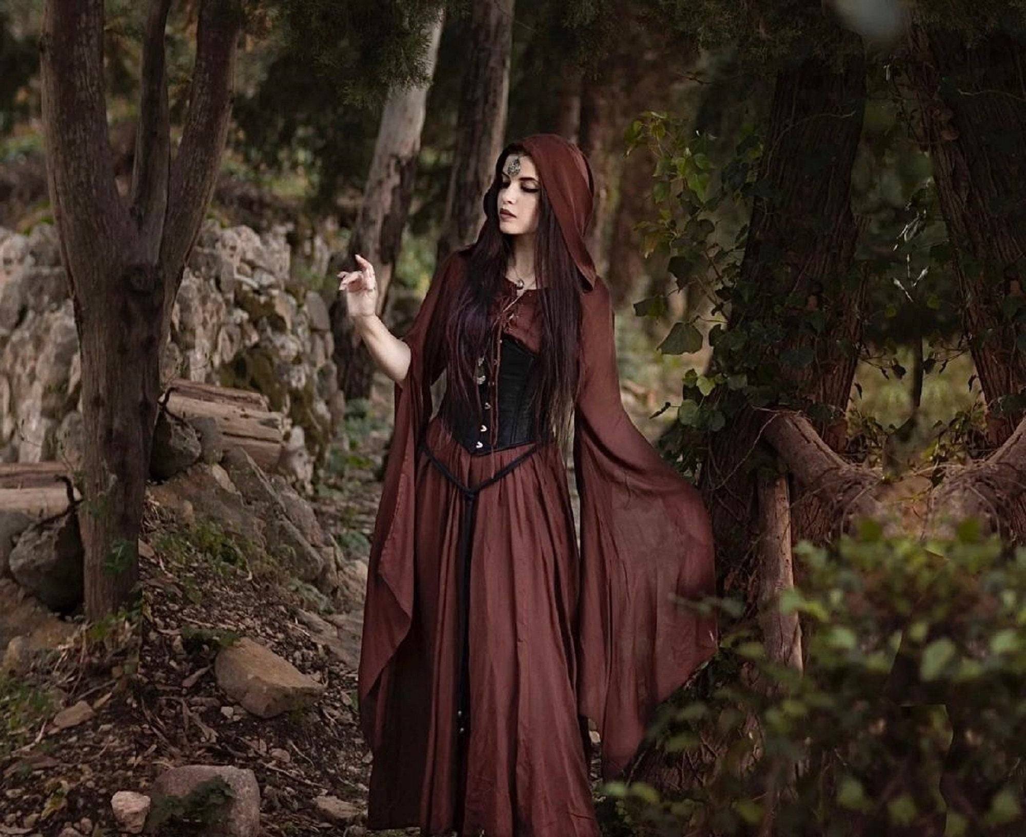 Hooded medieval maxi dress in deep brown with a flowing cape and corset detail, perfect for fantasy or renaissance-inspired fashion.