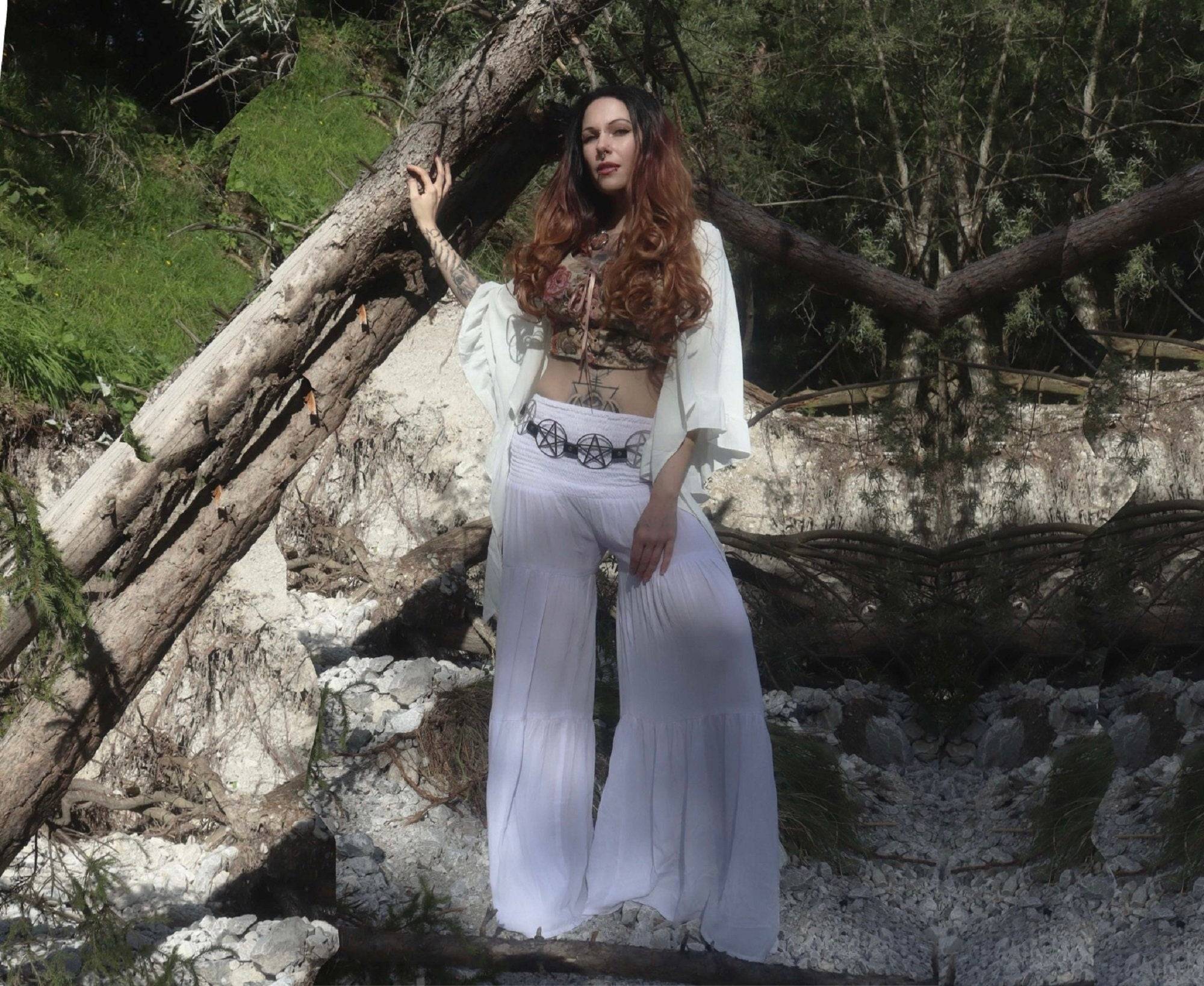 Bohemian-style white smocked waist ruffled palazzo pants with wide leg, ideal for all sizes from S-5X. Perfect for casual and elegant outfits.