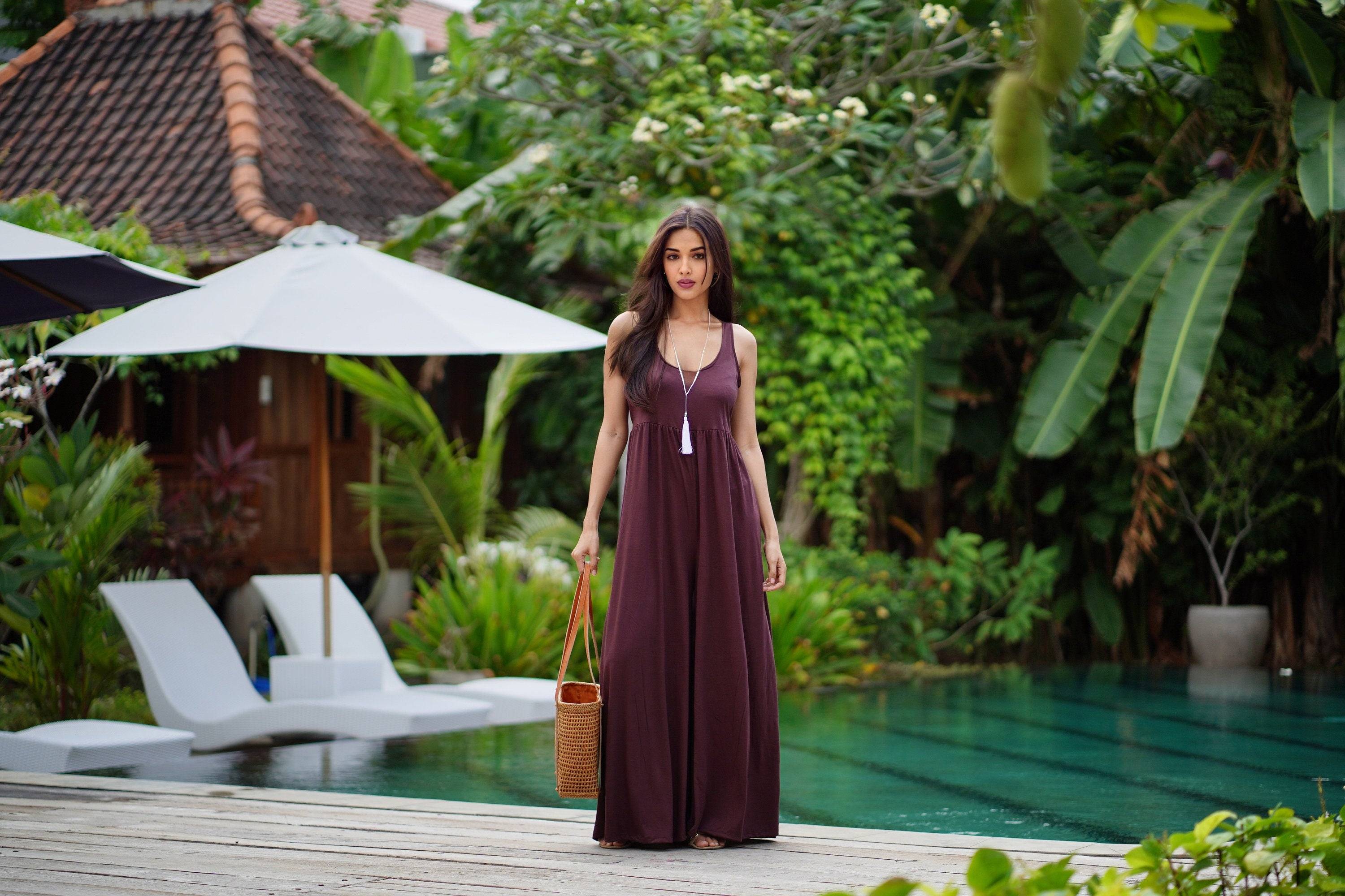 Chic brown stretchable jersey jumpsuit with an empire waist and wide palazzo legs. A flattering and comfortable fit for all sizes S-5X.