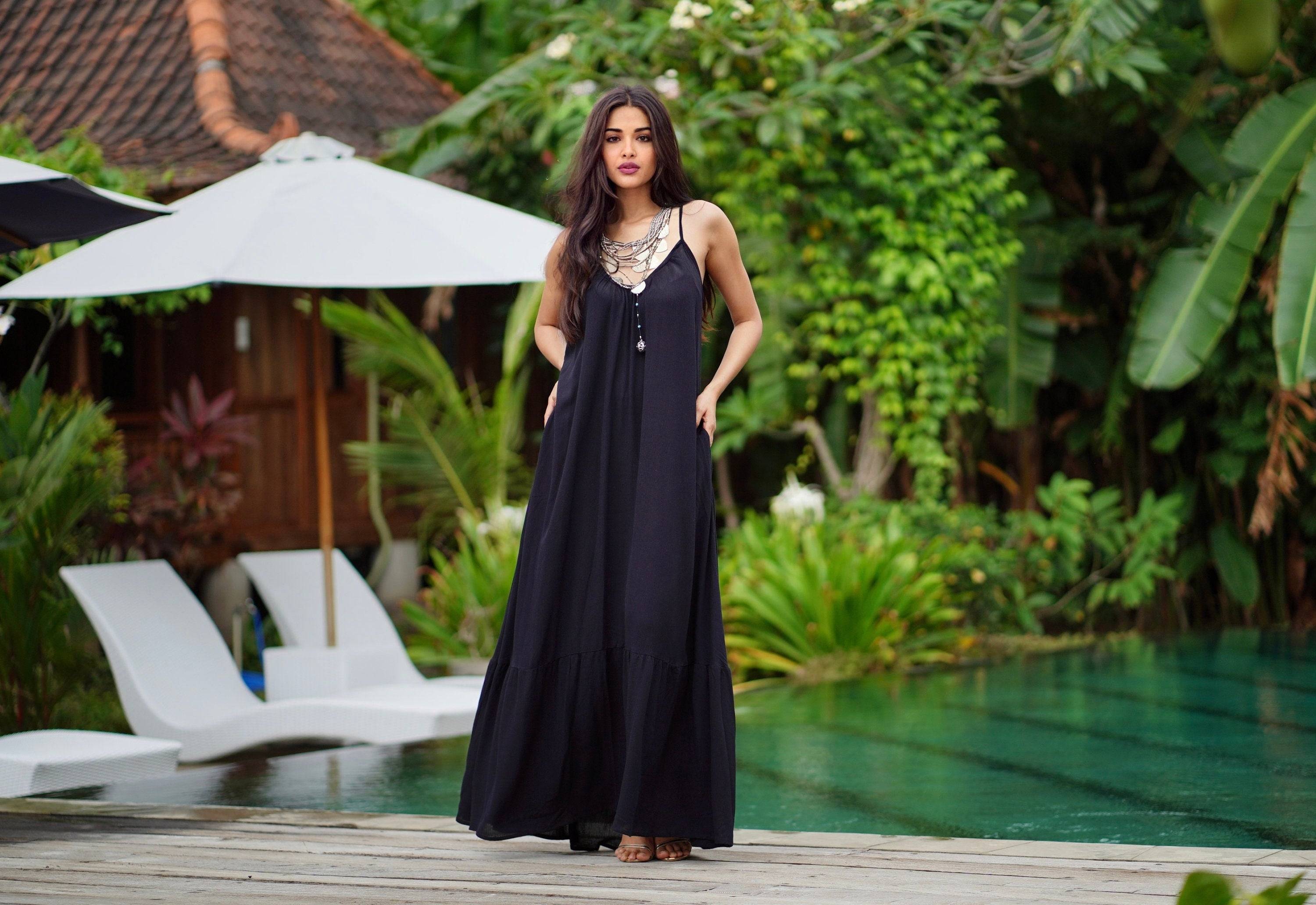 Classic black Renaissance maxi dress with a flowing silhouette and pockets. A versatile belted sundress perfect for all body types.