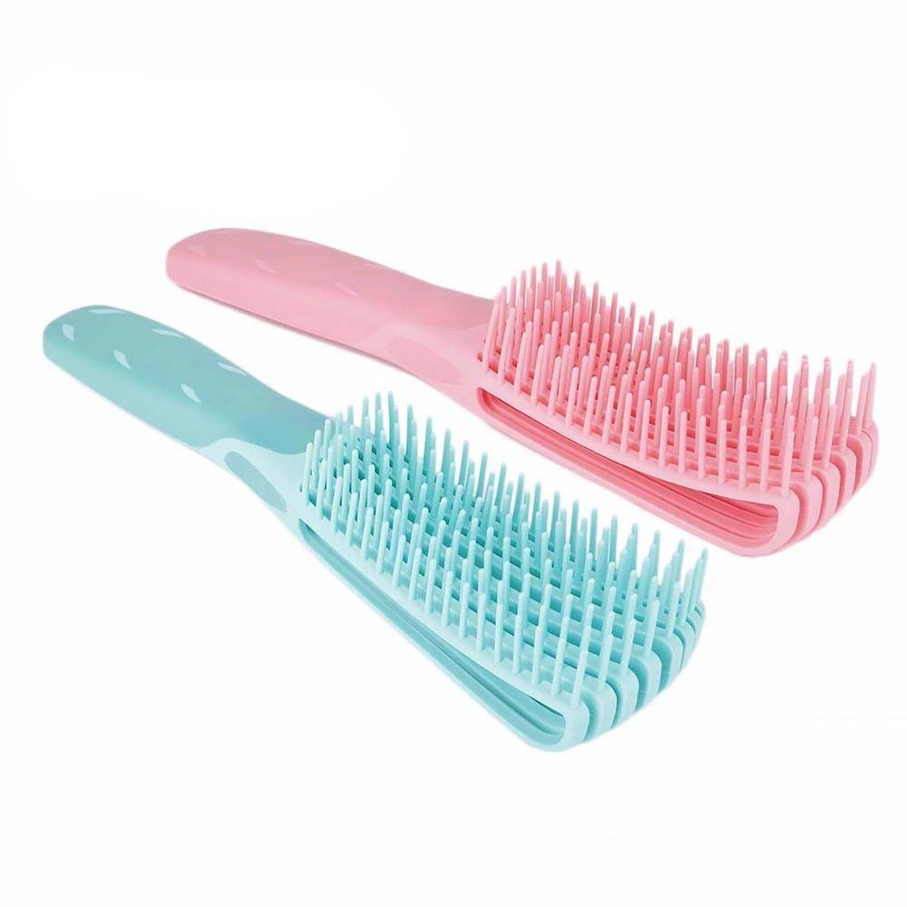 Set of two Painless Detangler Brushes in pink and blue, designed for 4C and 3A hair types to reduce breakage and ease detangling.
