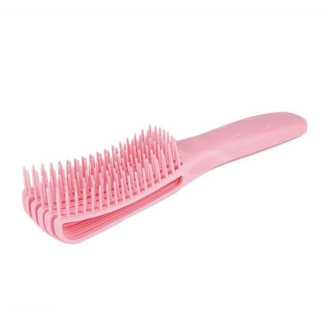 Pink Painless Detangler Brush for 4C hair, featuring flexible bristles for pain-free detangling and curl definition.