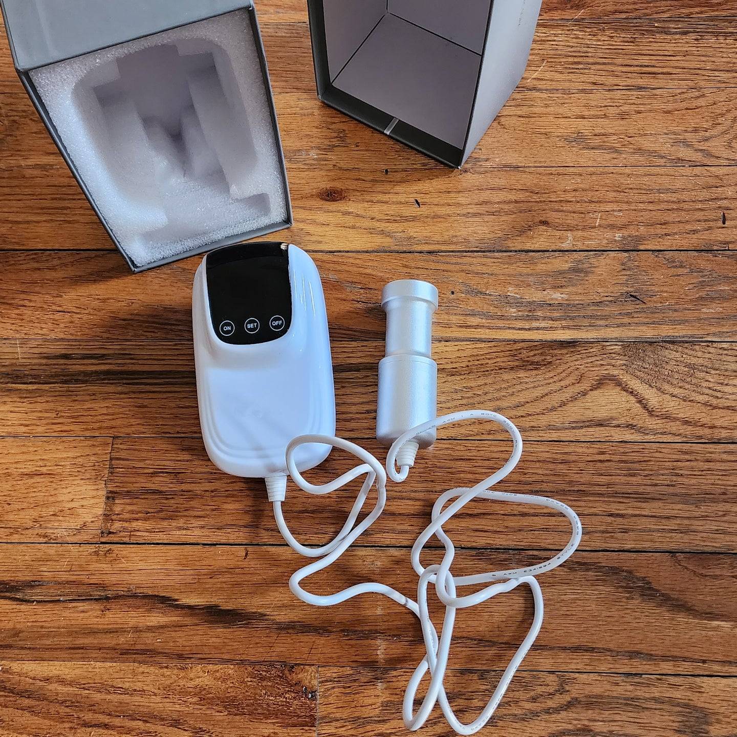 Sonic Loc Detox Rod device with a digital display and ultrasonic cleansing rod, designed for deep cleaning dreadlocks.