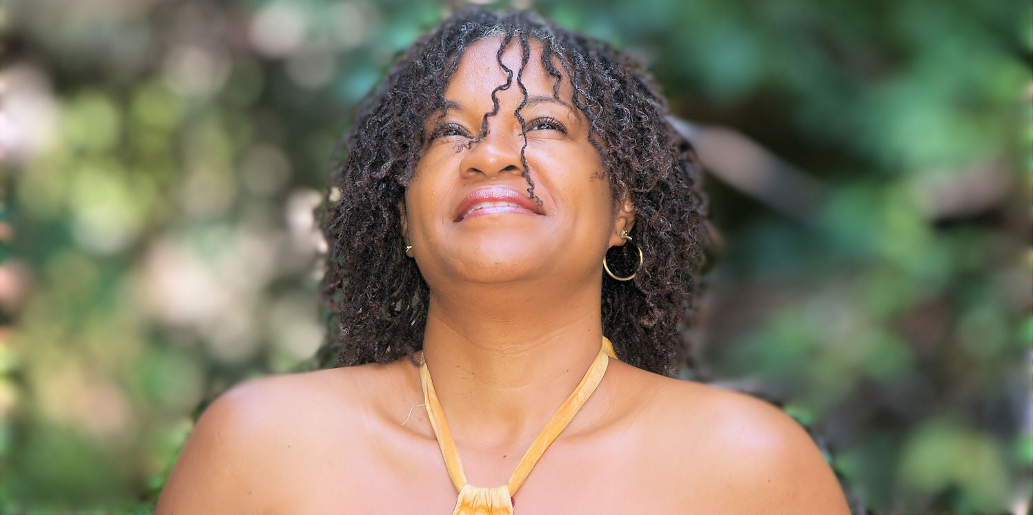 Microlocs half long braid out style Mirelle Liong