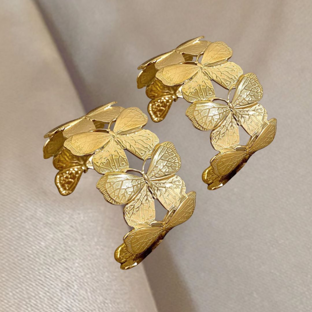 Gold butterflies Cuffs on a beige background