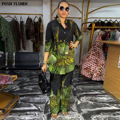 Stylish African two-piece pants set for women with a vibrant green and black print. A perfect blend of comfort and fashion for any event.