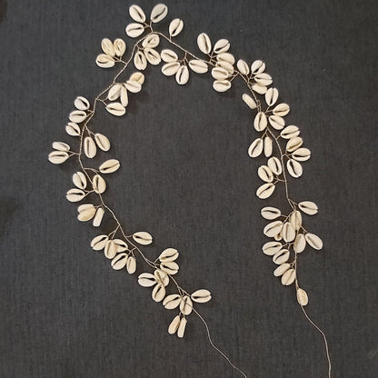 Chaîne bijoux cheveux coquillage cauri