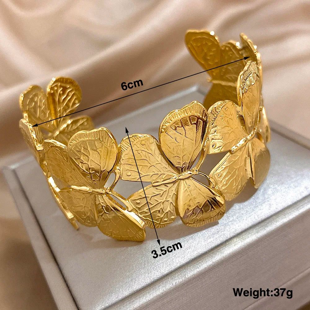 Butterfly gold hair cuff measured at 6 cm by 3.5 cm, showing weight and fit details.