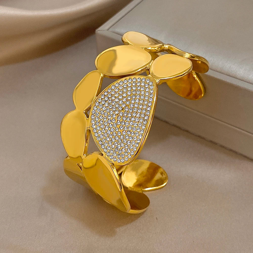  Gold Crystal Geometric Wide Cuff Bracelet on an jewelry box