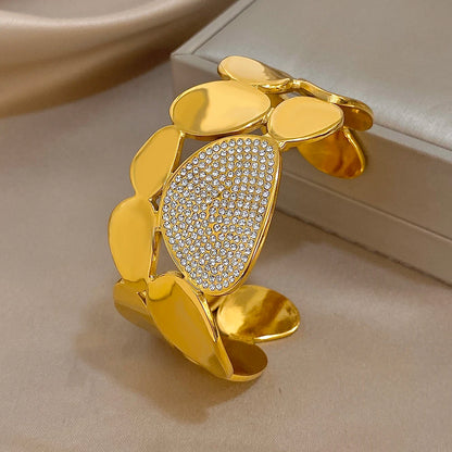  Gold Crystal Geometric Wide Cuff Bracelet on an jewelry box