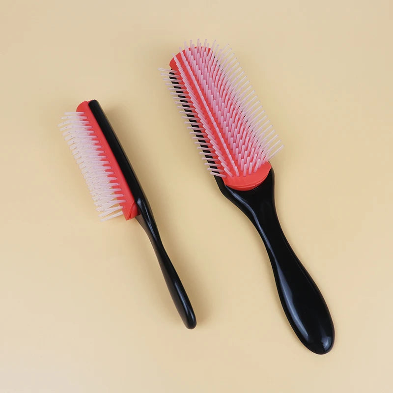 two denman brushes. One on side ways