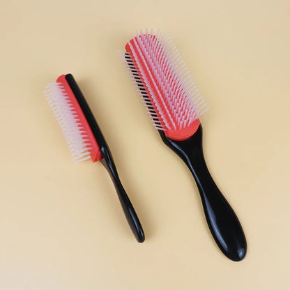 two denman brushes. One on side ways