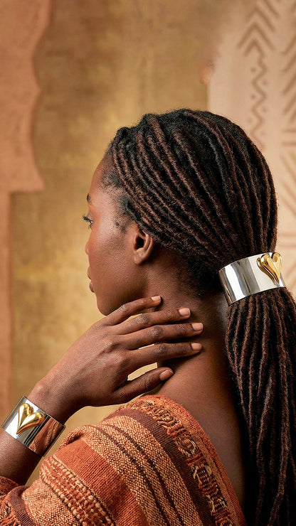 Black woman with locs in a low ponytail held together by the Elegant Heart Hair Cuff to Show your Hair some Love