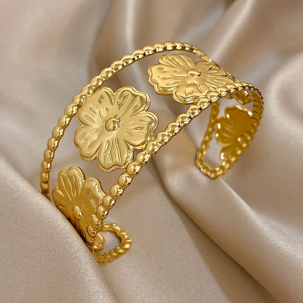Close-up of Gold Flower Hair Cuff showing intricate petal engravings and textured edge