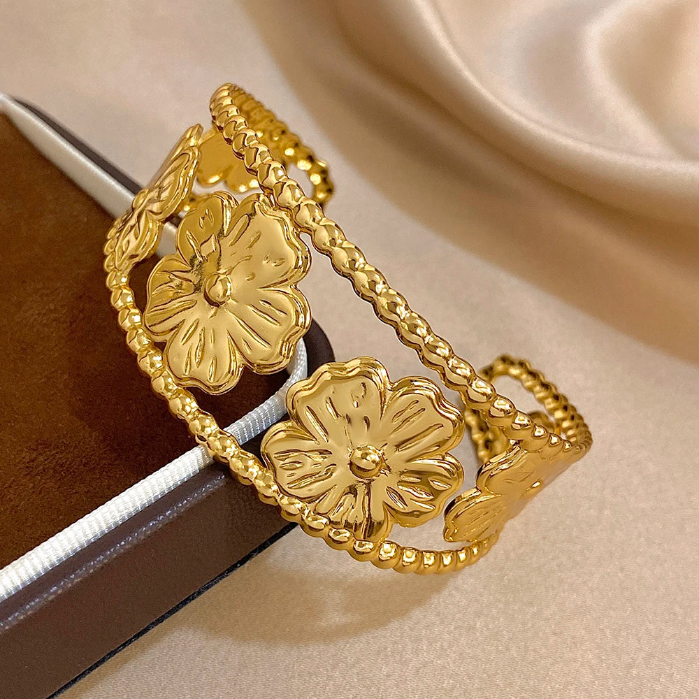 Gold Flower Hair Cuff placed on jewelry box, showcasing floral pattern