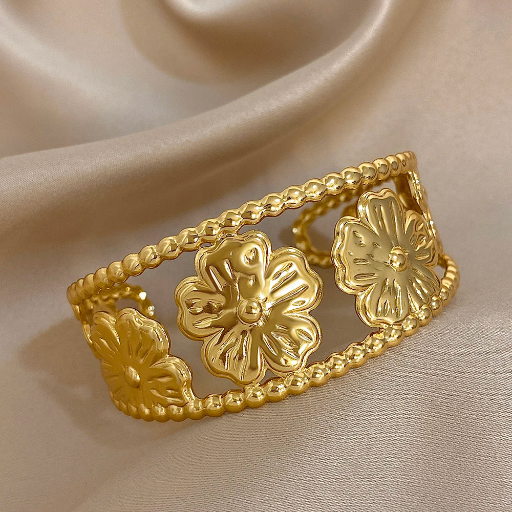 Bold Gold Flower Hair Cuff with open hollow floral design for vintage-inspired looks.
