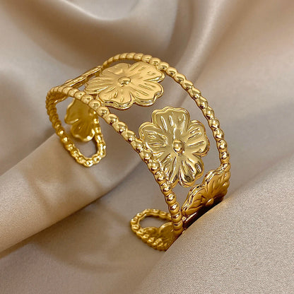 Bold Gold Flower Hair Cuff with open hollow floral design for vintage-inspired looks
