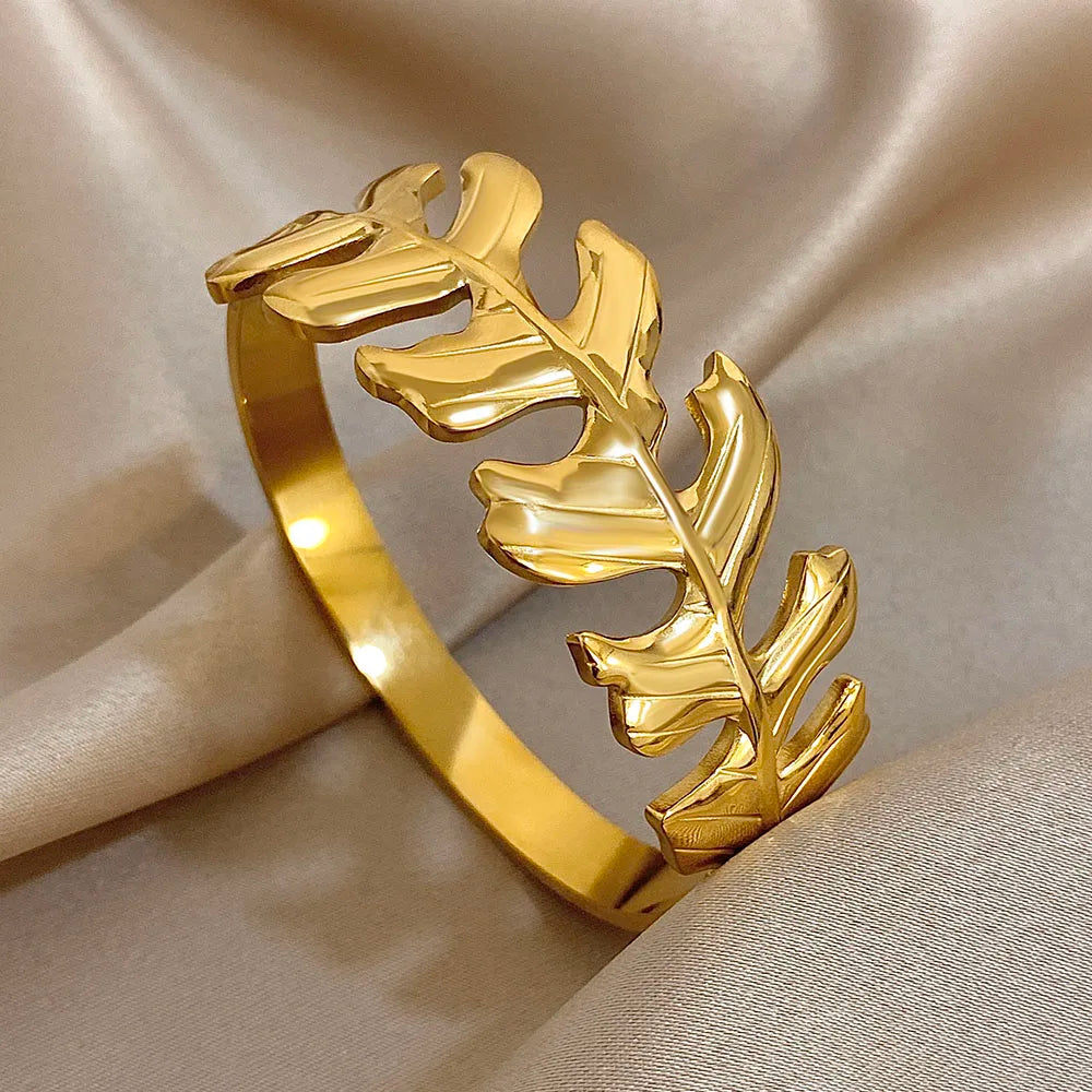Gold Leaf Hair Cuff with sculpted leaf design and glossy finish, displayed on satin background