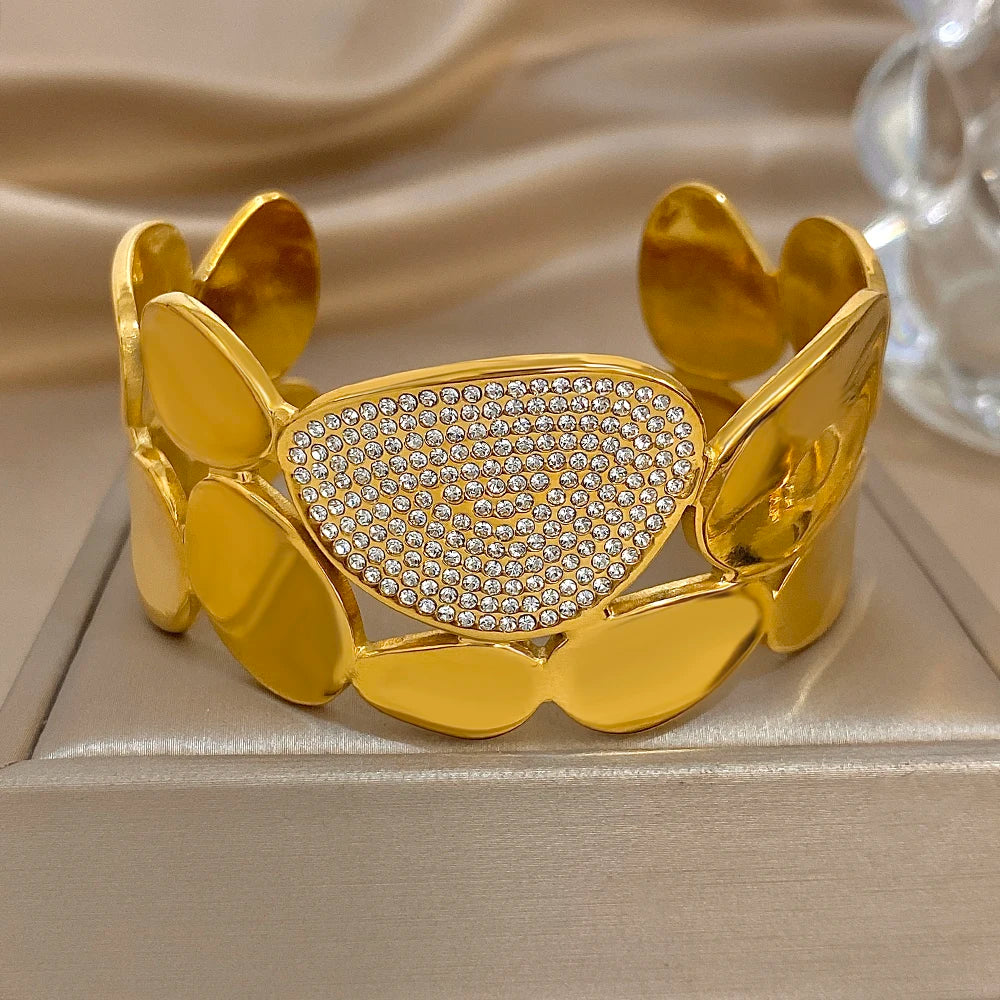 Gold Crystal Geometric Wide Cuff Bracelet on an jewelry pillowcase