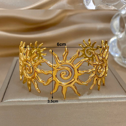 Gold Spiral Sun Hair Cuff with Matching Bracelet is 3.5 cm long and 6 cm wide