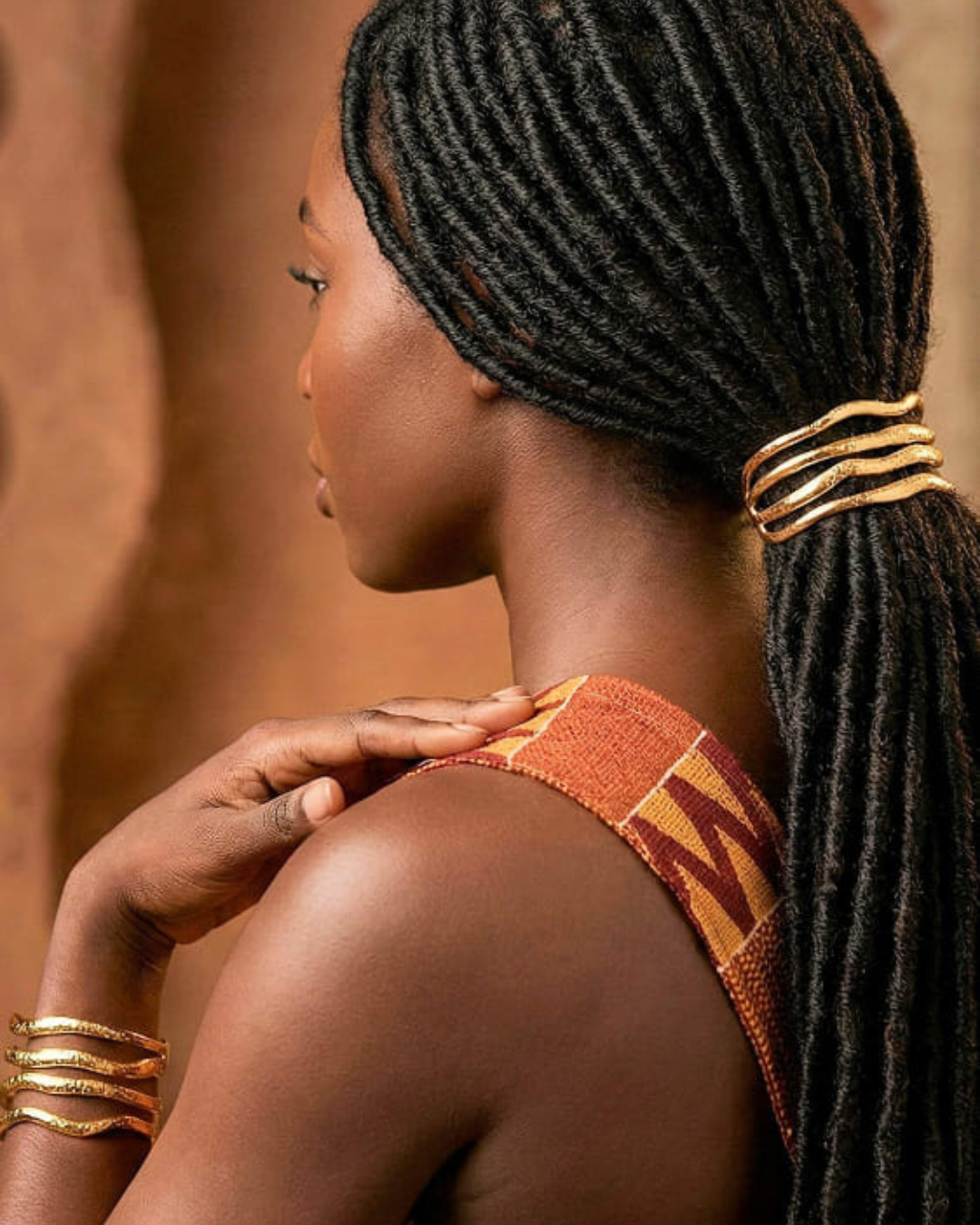 Black_woman_with_locs_in_a_ponytail_held_together_by_a_cuff_8-edit